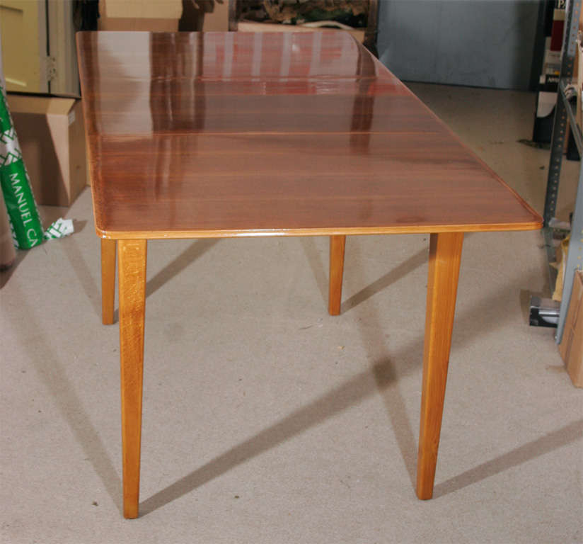 An extending oak dining Table by Gordon Russell of Broadway.
Label to base.